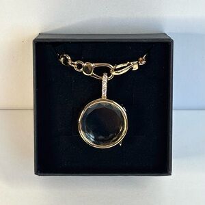 Gold circular glass locket (multiple available upon request)